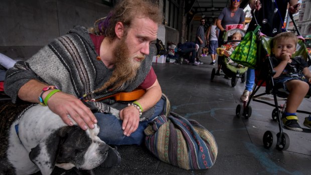 Glen, 32, with his dog, Tonka, at the Flinders Street Station camp.