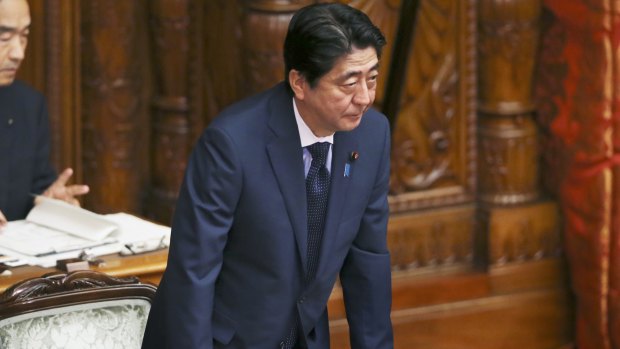 Japanese Prime Minister Shinzo Abe acknowledges a censure motion against him filed by an opposition party. It was rejected during the upper house plenary diet session in Tokyo on Friday.
