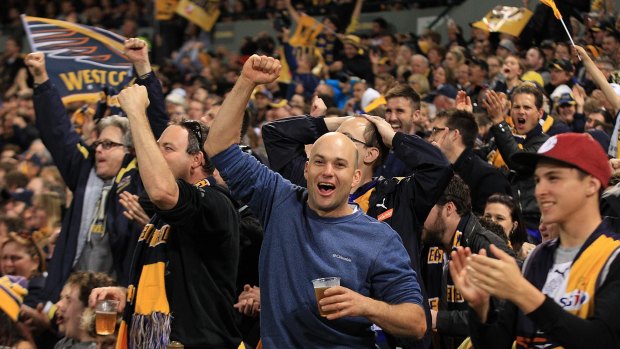 Eagles fans celebrate a goal during the qualifying final win against Hawthorn.
