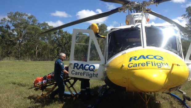 A woman in her 40s was flown to Brisbane's Princess Alexandra Hospital after being injured while tending a horse. 