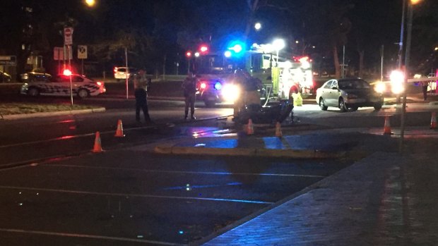 Police at the scene of the two-vehicle crash in Manuka on Friday night.