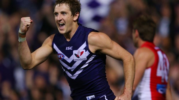 Michael Barlow has overcome a late start and a badly broken leg to become an AFL 100-gamer.