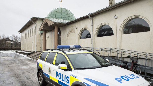 Police car in front of a mosque in Uppsala, Sweden, after a burnt-out Molotov cocktail was found early on Thursday.