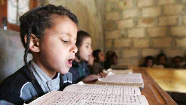 Yemeni Jewish boys read the Torah at a Hebrew school in the north-western Yemeni town of Raida. A few families are all that remain of Yemen's ancient Jewish community.