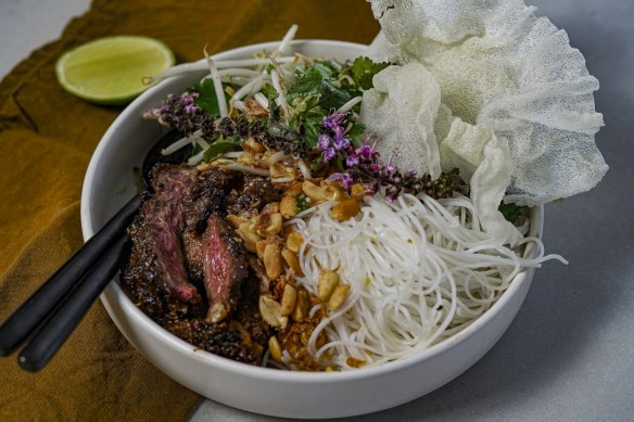 Black pepper and makrut lime beef bowl with vermicelli noodles and herb salad.