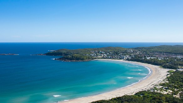 Coastal aerial of Fingal Beach in Fingal Bay, Port Stephens.