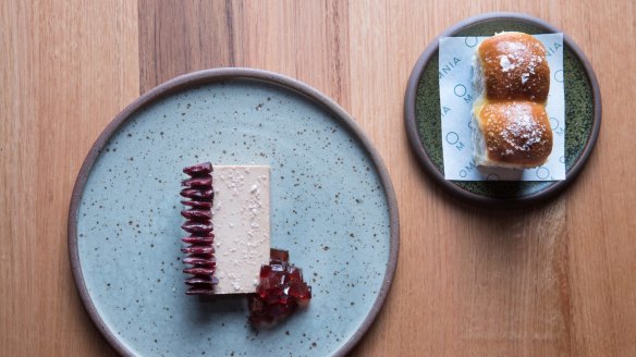 Duck parfait with preserved cherries and parker house rolls.