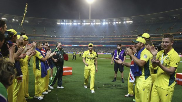 The Australian team form a guard of honour for Michael Clarke as he leaves the field after Sunday's World Cup final at the MCG.  