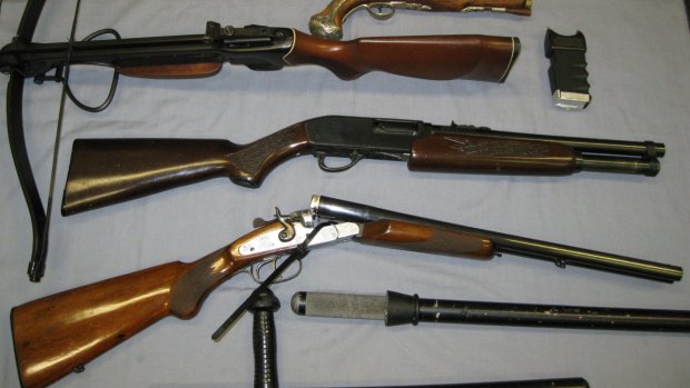 Guns and ammunition were seized by police at Mudgeeraba.