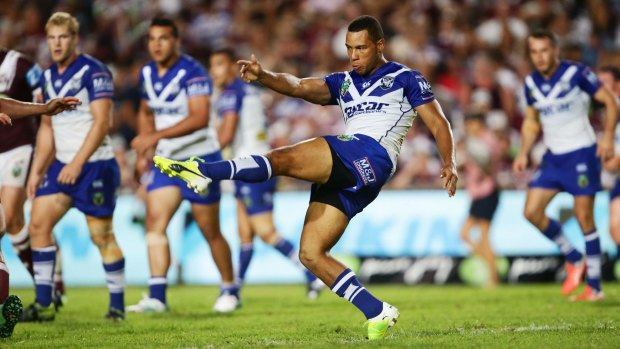 In form: Moses Mbye takes a kick during the recent win over Manly.