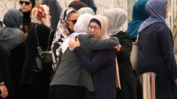 Women embrace before attending the funeral of Banksia Road Public School student Jihad Darwiche at Lakemba Mosque.