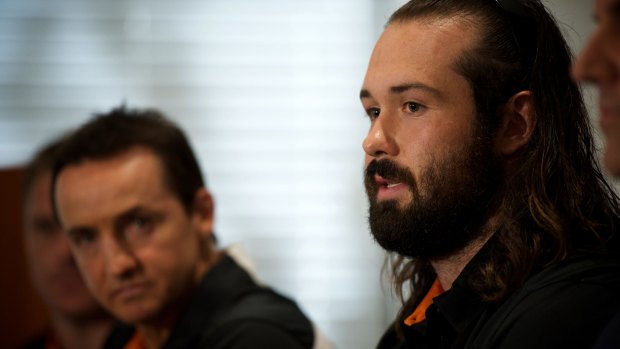 New Wests Tigers captain Aaron Woods speaks to the media with coach Jason Taylor.

