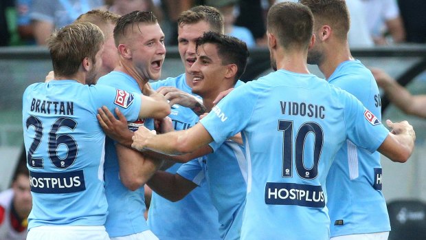 City's Marcin Budzinski celebrates with team mates after scoring the opening goal in their 5-0 win over Adelaide.