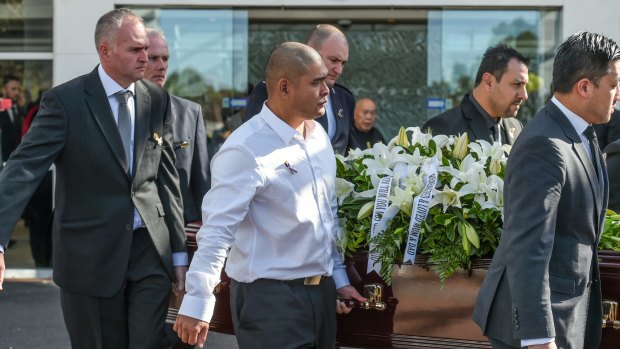 Michael Chan, along with family and friends, carry the coffin of Andrew Chan following a funeral service in Sydney.