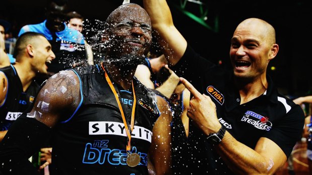 Party time: Assistant coach Judd Flavell pours champagne on Cedric Jackson after the Breakers won game two of the NBL Grand Final series against the Cairns Taipans in March.