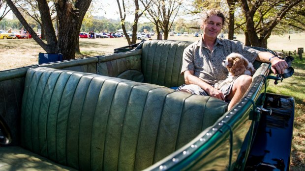 Ross Merdal with his dog, Charlie, in a 1924 Sunbeam at the Wheels event in Kings Park.
