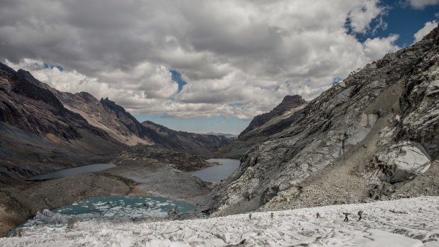 Glacier researchers at work, bottom right, on Gueshgue glacier, in the Cordillera Blanca region of Peru.