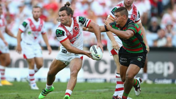 Trying to rein him in: South Sydney's defence tries to shut down an attacking raid from St George Illawarra hooker Mitch Rein during the Charity Shield at ANZ Stadium.