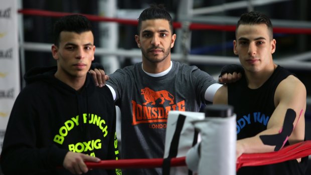 Dib, centre, training his brothers Youssef  and Billel.