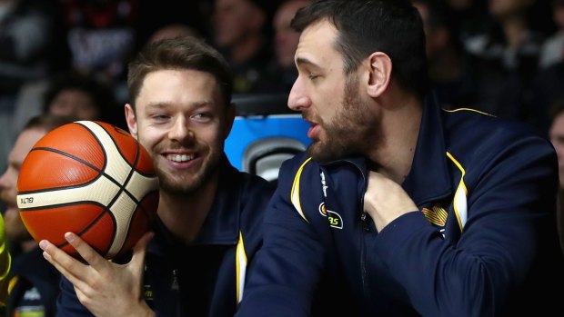 Matthew Dellavedova and  Andrew Bogut watch from the bench during the Boomers match.