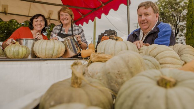 Felicity Poile and the soup recipe's creator Carolyn Hannan with president of the Collector Villiage Pumpkin Festival, Gary Poile.