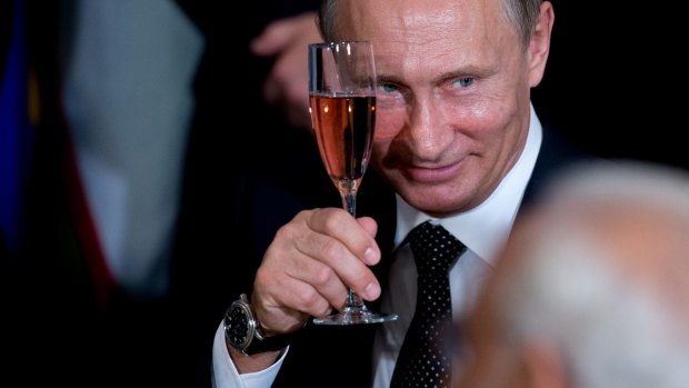 Russian President Vladimir Putin toasts at a luncheon hosted by United Nations Secretary-General Ban Ki-moon. 