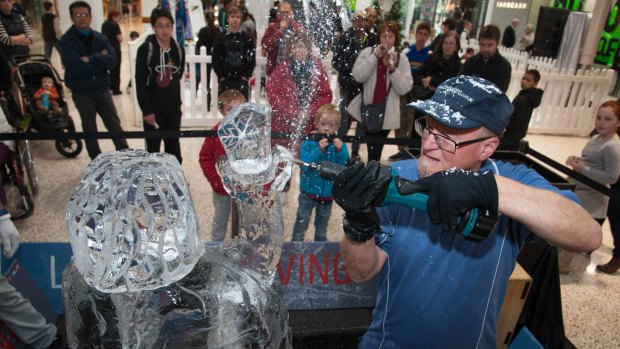 For artist Glenn Smith, creating ice sculptures in the comfortable temperatures of Woden Westfield is proving a challenge this week.
