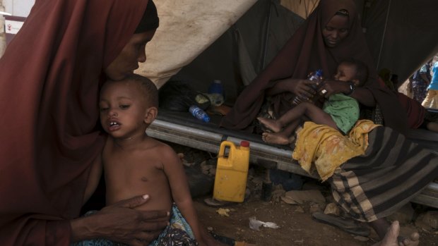 Mothers tend to their children at a cholera treatment centre in Baidoa, Somalia.