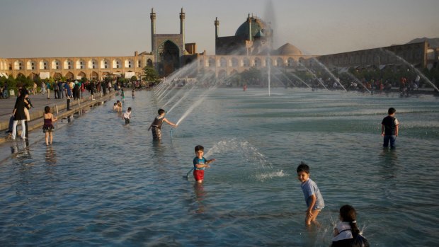 Kids playing in fountains in Naqsh-e Jahan Square. 