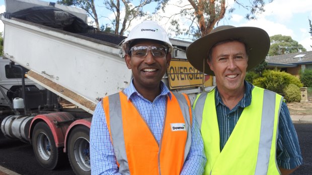 Downer manager Gana Varendran and ACT Roads maintenance manager Peter Thompson.