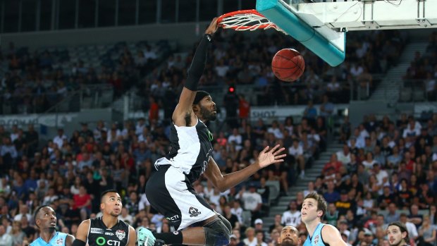 On a high: Melbourne United's Hakim Warrick dunks during the semi-final against New Zealand Breakers at Hisense Arena on Thursday.