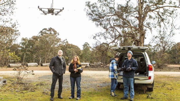 Dr Adrian Manning, Dr Debra Saunders, of the ANU, Oliver Cliff (in the blue chequered top) and Jeremy Randle (piloting the drone), from the University of Sydney.
