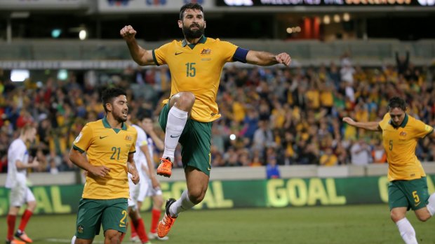 Socceroos captain Mile Jedinak celebrates after scoring at Canberra Stadium in November last year.