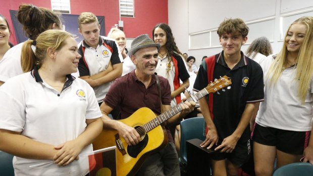 Freedom Ride 2015: Singer Paul Kelly sings a song with Dubbo school students at Dubbo Senior Campus.