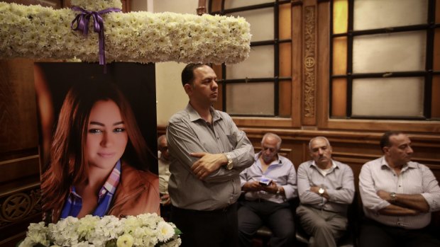 Friends and relatives of EgyptAir hostess Yara Hani, who was working aboard flight MS840, mourn during a ceremony at a church in Cairo on Saturday.