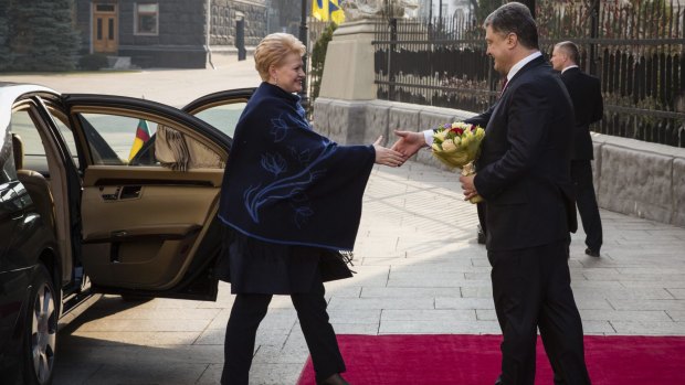 Ukrainian President Petro Poroshenko, right, greets Lithuanian President Dalia Grybauskaite in Kiev on March 21.