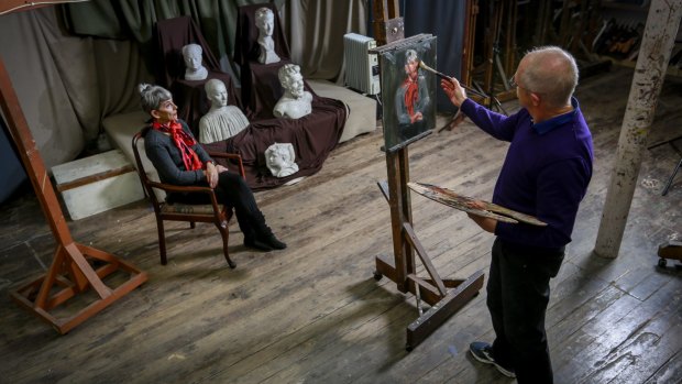 Artist Ray Wilson works on a painting of model Anne Scott Pendlebury at the Victorian Artists Society, which today announced it would need to find $1 million to ensure the heritage integrity of its National Trust registered building in Albert Street, East Melbourne.