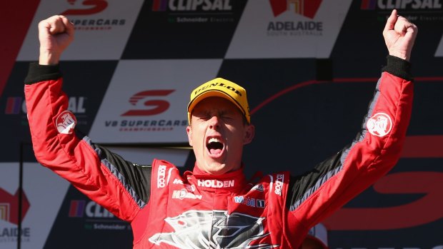 Sweet success: James Courtney celebrates his victory.