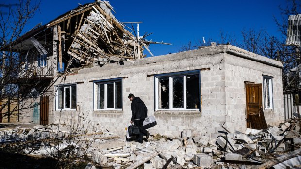 Front line: A home destroyed by shelling in Donetsk.