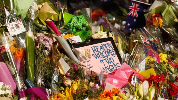 Flowers and messages left outside the  Lindt Cafe in Sydney after last month's seige.