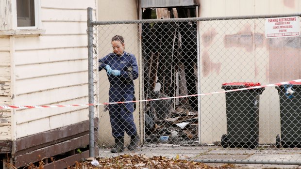 Police at the scene of one of two suspected arson attacks in Clayton on Saturday.