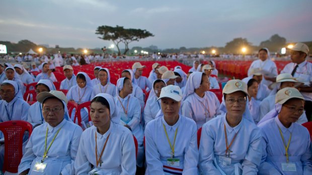 Members of Myanmar Catholic clergy gather to hear Pope Francis say Mass in Yangon, Myanmar, on Wednesday.