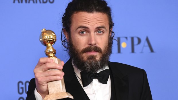 Casey Affleck poses with his Golden Globe earlier this month.