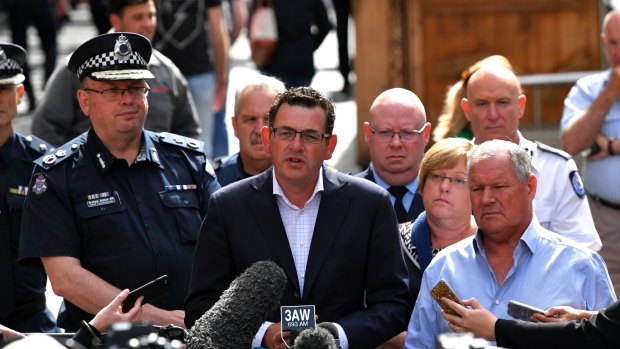 Chief Commissioner Graham Ashton, Premier Daniel Andrews, and lord mayor Robert Doyle address the media. 