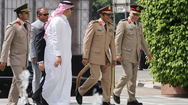 Saudi Arabia's Chief of Staff Abdulrahman Al-Banyan, second from right, arrives at the Arab League headquarters last week.