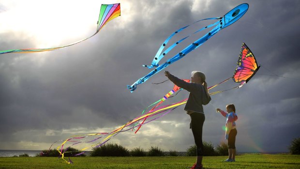 With a strong southerly breeze on the coast, Maya Miller and friend Hayley learn the art of flying kites through practice at a park in Coogee, Sydney.