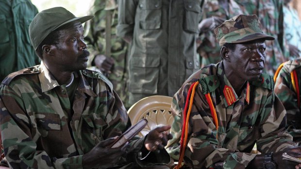 Lord's Resistance Army leader, Joseph Kony, left, and his deputy Vincent Otti sit inside a tent at Ri-Kwamba in Southern Sudan in 2006. 