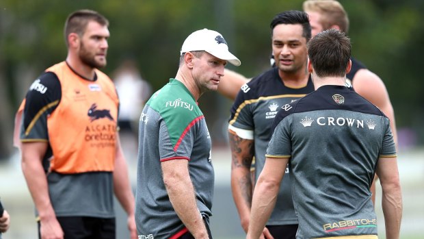 Undecided: Souths coach Michael Maguire talks with John Sutton and Luke Keary during a South Sydney Rabbitohs training session at Redfern Oval on Monday.