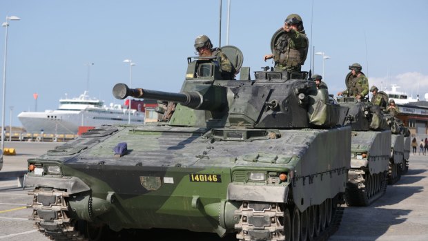 Swedish armored personnel carriers in Visby harbour on the island of Gotland, Sweden. 