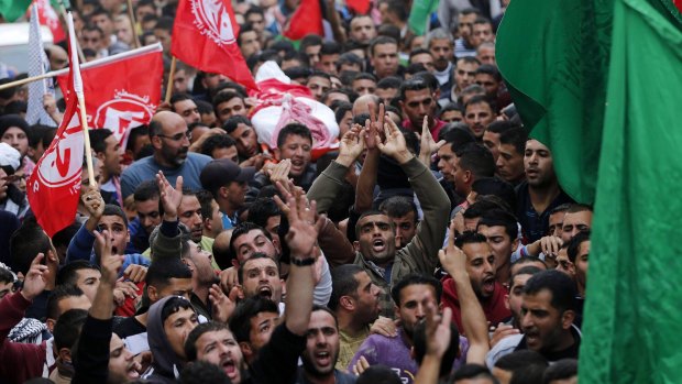 Angry backlash: Mourners at the funeral of Mohammed Jawabreh, who was shot by Israeli troops.
